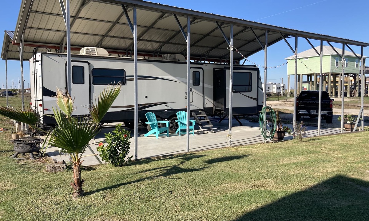Port Bolivar House | 10 minutes walk to the beach .Covered rv spot on concrete slab. NEW CAMPER