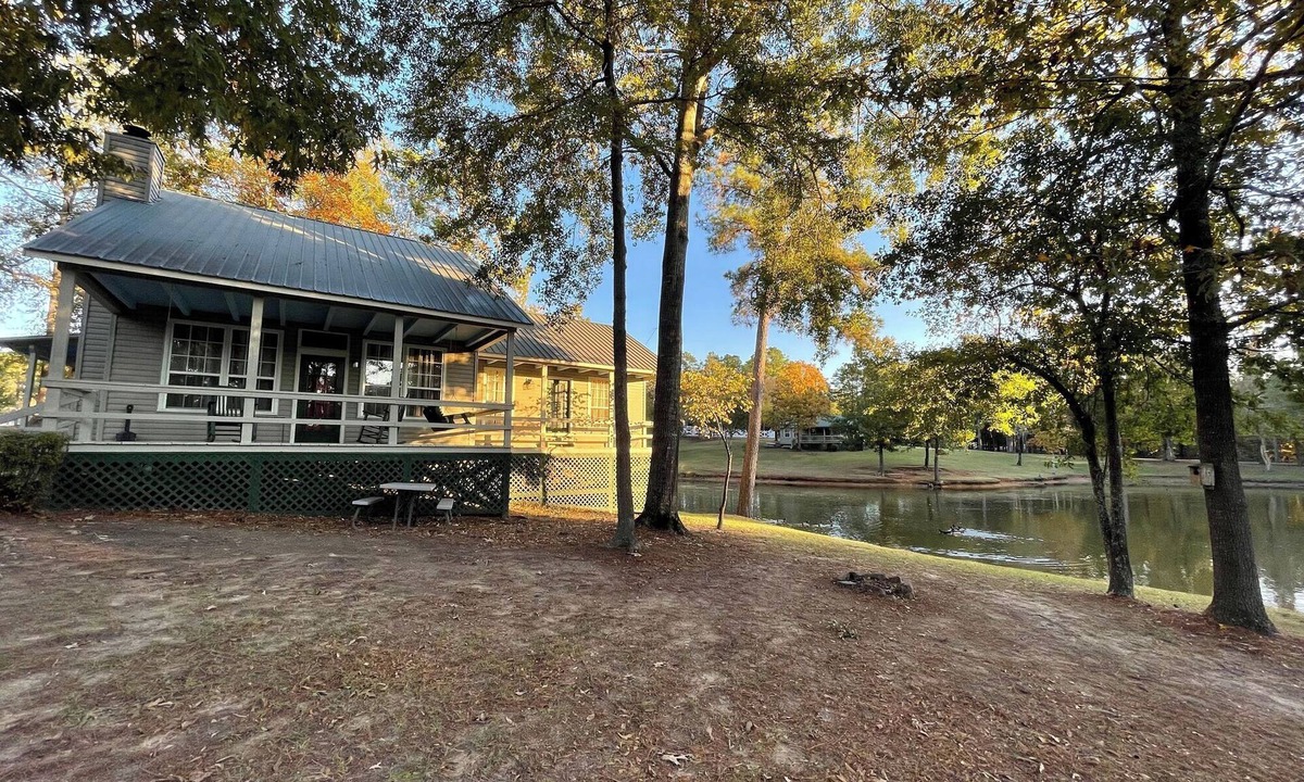 Zwolle Cabin | Couples Retreat with King Canopy Bed, Jacuzzi for Two, Fireplace & Pond-View Porch