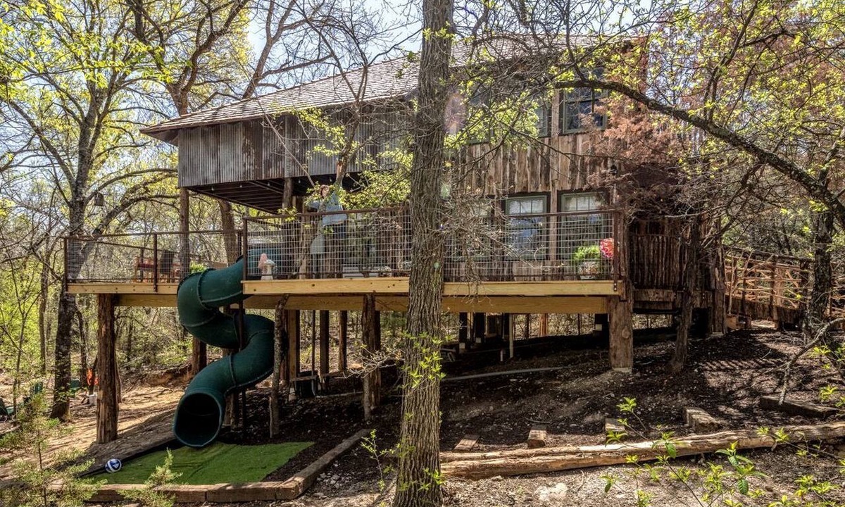 Dennis House | Magical Treehouse with Slide by Brazos River for Family Glamping Adventures in Texas