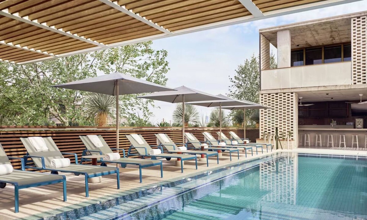 South River City Hotel | One-Bedroom Hotel Suite with Living Room & Outdoor Space