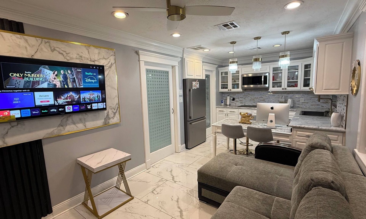 FM 1960 House | Private Luxury Poolside Guest Suite with Fire Pit & Modern Interior