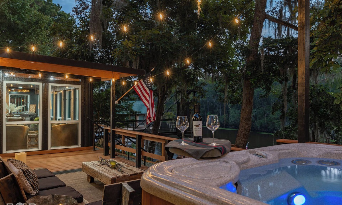 Jefferson Cabin | Relax and unwind at The Whiskey Barrel, a cozy waterfront retreat designed for fun and laid-back lake living. Soak in your private hot tub, paddle out with the kayaks, or spend the afternoon on one of the 4 decks reading a good book