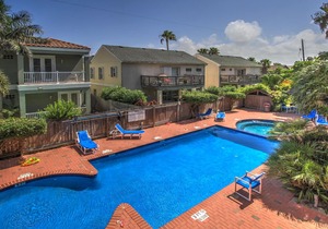 Spacious oasis near the beach with a private balcony, pool, and hot tub
