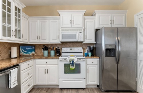 Crystal Beach House | 4-bedroom family home walking distance to the beach. 27 miles of golf cart fun.