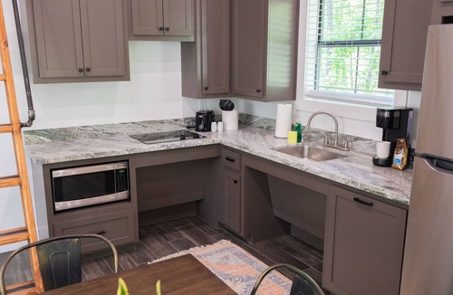 Oakhurst Cabin | A cozy little ADA accessible getaway right on Kickapoo Creek. Two Creeks Crossing Resort