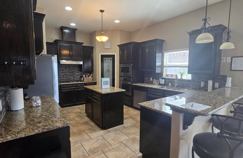 South Side House | A family-friendly retreat featuring a pool, hot tub, and spacious outdoor area.