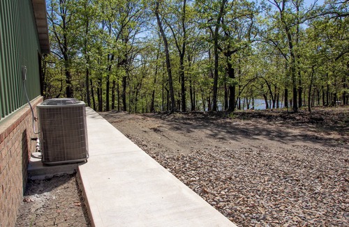Carlisle Cabin | Beautiful Cabin with View of Private Lake, Hot Tub, Fire Pit & Outdoor Swings!