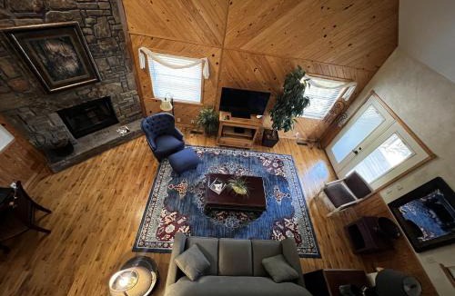 Mount Ida House | C18 - Lake view two bedroom, two bath loft, log-sided cottage with private hot tub overlooking Lake Ouachita