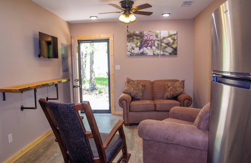 Carlisle Cabin | Cabin Bunkhouse with Hot Tub on Private Lake, Fire Pit & Swings in Vian, OK!