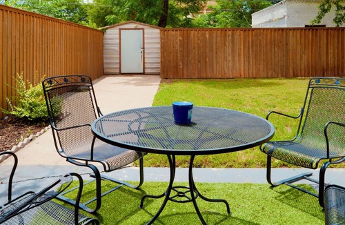 Over Place Area House | Centrally Located Spacious 3BR Storybook Cottage on Sayles Blvd