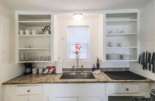Shady Acres House | Charming 2-story private home sleeps 8 in the Heights with fast WiFi, smart TVs, ample parking, and a fenced patio + yard. Features a primary queen ensuite and quick access to Downtown.