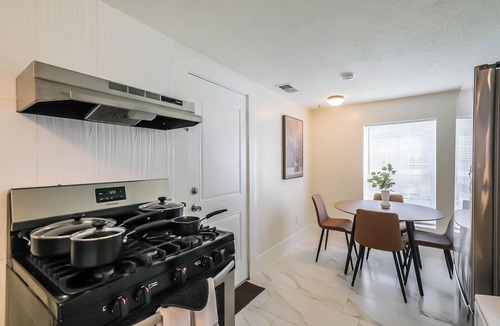 Shady Acres House | Charming 2-story private home sleeps 8 in the Heights with fast WiFi, smart TVs, ample parking, and a fenced patio + yard. Features a primary queen ensuite and quick access to Downtown.