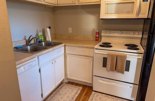 Lake Charles Apartment | Charming Two-Story Quadplex with Bedroom Balcony & Living Room Patio