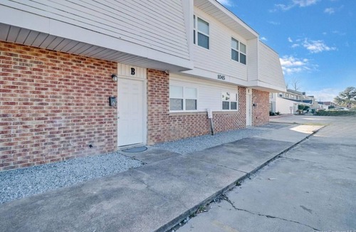 Lake Charles Apartment | Charming Two-Story Quadplex with Bedroom Balcony & Living Room Patio