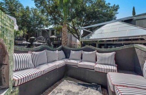 Junius Heights Condo | Cozy 2-story loft with fireplace, luxury linens, full kitchen, and award-winning courtyard.