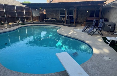 Lewisville House | Dive In! The Poolside Escape with a Hot Tub, Grill, Game Room & Good Times.