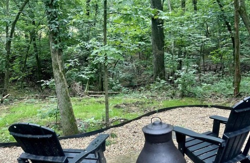 Gentry RV Rental | Enchanting Mountain Glamping Tents with Elevated Decks and Fire Pit Near Gentry, AR