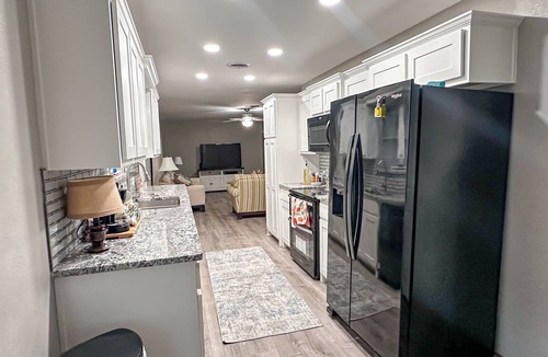 Gainesville House | Enjoy farmhouse charm in this 4-bedroom, 2-bath ranch retreat just minutes from downtown Gainesville, the Frank Buck Zoo, and local parks. Sleeping up to 10, it’s perfect for families or group getaways, offering a bright open layout and cozy country