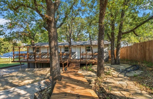 Bowie Cabin | Escape to a Cozy Lakefront Cabin on Lake Amon Carter with Private Dock