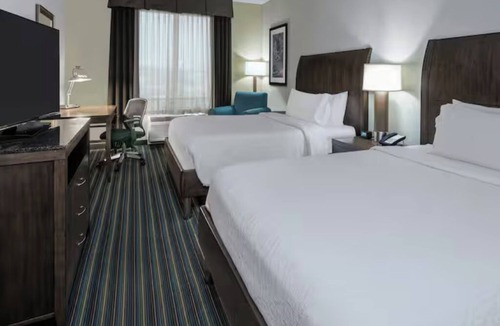 Far North Central Hotel | Escape to Comfort in a Quiet Room Near The Rim Shopping Center - 0.7 miles