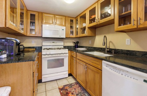 Central Carrollton Association House | Fabulous 2-bedroom townhome with parking!