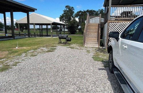 Hackberry House | Fishing camp with boat stall cleaning table three bedroom two bath