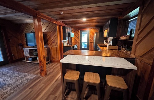 Lequire Cabin | FUN! Log Cabin Hot Tub & Game Room w Pool Table Pets OK 3BR/2BA Sleeps 10