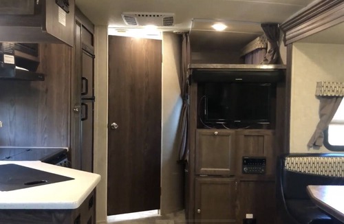 Lafayette House | Glamp in a cozy RV waking up to Nature Trails out your front door.