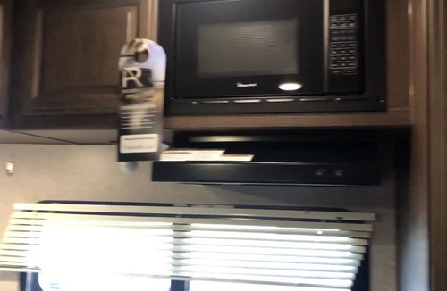 Lafayette House | Glamp in a cozy RV waking up to Nature Trails out your front door.
