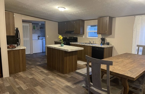 Many House | Great location. covered patio/5 minutes away from restaurants stores boat launch