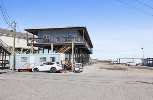 Delacroix Cabin | Great view of bayou-fishing lodge- sleeps 6. Fish cleaning station & BBQ pits.