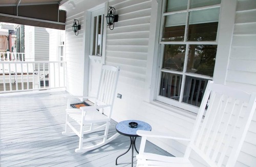 Uptown Historic District Apartment | Historic 3BR on Magazine St with front & rear balconies. Walk to cafés, quick ride to FQ & Dome.