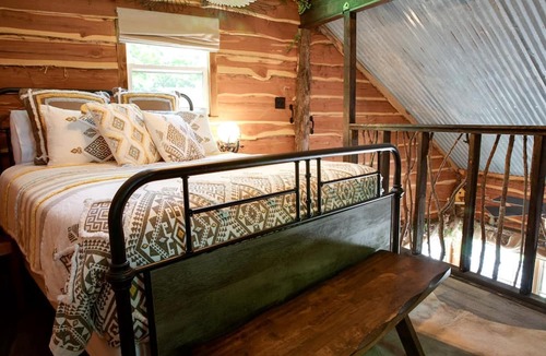 Dennis Cabin | Hobbit Treehouse with Waterfall on the Brazos River for Glamping in Texas