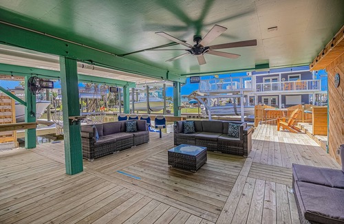 Jamaica Beach House | Inviting waterfront home with hot tub, kayaks, game room, W/D, & dog-friendly
