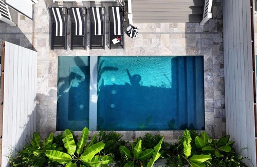 Faubourg Lafayette House | Luxe 7 bedroom Heated Pool and Spa Stay Heirloom