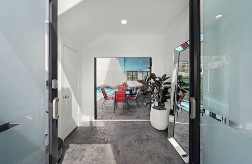 Greenway Plaza-Upper Kirby House | Luxe Kirby Retreat. Heated Pool, King Suites & Games. Secluded, Central Setting