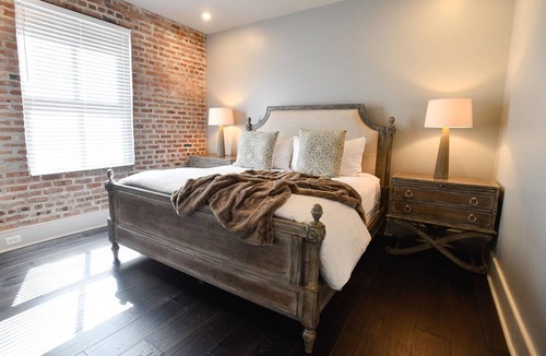 Central Business District Hotel | Luxurious Charm: Elegance with Exposed Brick Walls in New Orleans' CBD