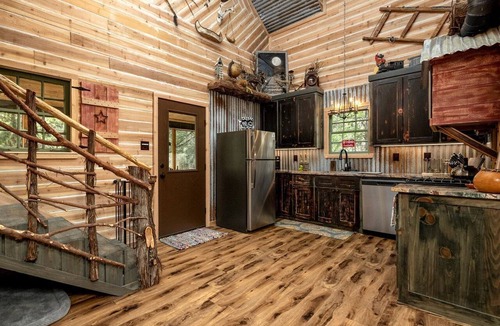 Dennis House | Magical Treehouse with Slide by Brazos River for Family Glamping Adventures in Texas