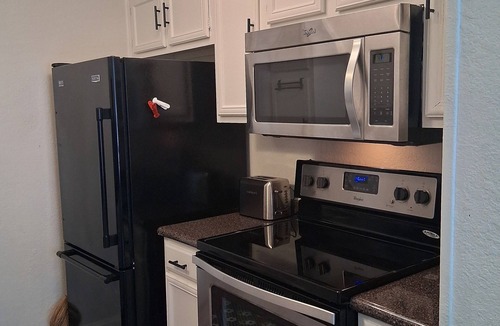 Vickery Meadow Condo | Modern 2 bedroom with 2 fire places and a 9 mile walking/biking trail