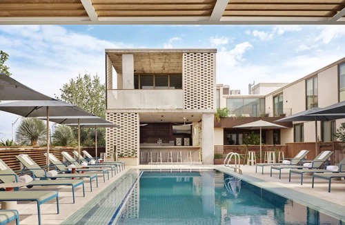 South River City Hotel | One-Bedroom Hotel Suite with Living Room & Outdoor Space