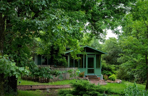 Sylvan Shores Cottage | Peaceful wooded cottage with seasonal lake views, WiFi, private parking, & patio