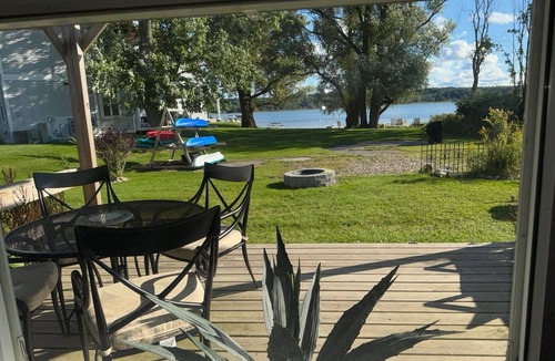 Onekama Apartment | Private beachfront 2BR w deck and firepit in Onekama