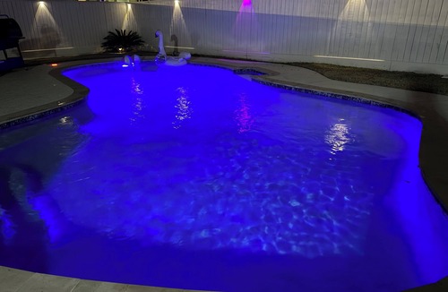 FM 1960 House | Private Luxury Poolside Guest Suite with Fire Pit & Modern Interior