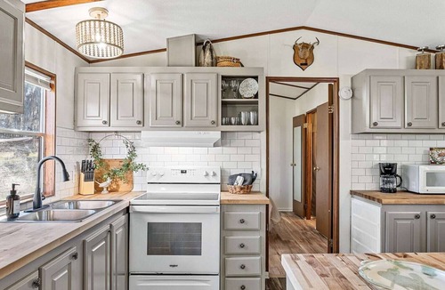 Uncertain Cabin | Relax on the water at this lakefront cabin with private dock access, fishing pier, and kayaks included.