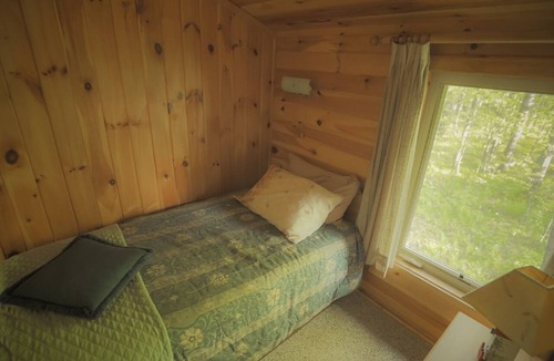 Finlayson Cabin | Rustic Two Level Tree Lodge Surrounded By The Forest With Fireplace And Fire Pit