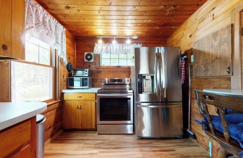 The Bays Cottage | Secluded bayfront cottage with private beach, grill, & bay views