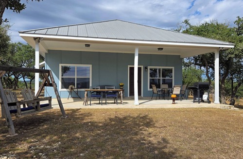 Dripping Springs Cottage | The Cowhouse, a cozy hilltop guesthouse at Barkspin Oaks Ranch. Beautiful views!