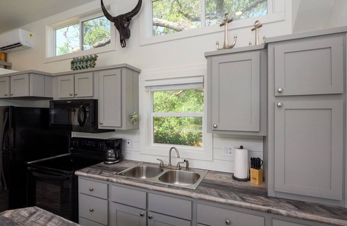 Rockport Cottage | The Live Oak Tiny House with fence