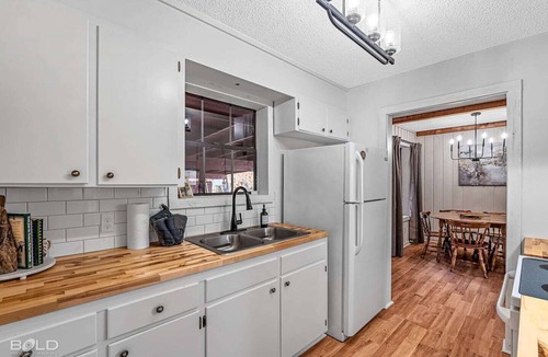 Uncertain Cabin | Unwind in a cozy rustic-modern cabin with a front porch, private dock access, firepit nights, outdoor dining, and cornhole. RV site next to house.