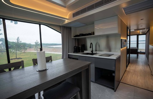 Runaway Bay Apartment | Vessel 8 - Lakefront Vessel Living | Modern Touches Grill Nature Views